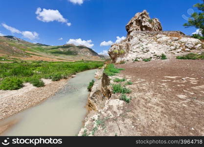 Mountain Stream between the Volcanic Hills of Sicily