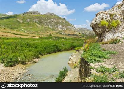 Mountain Stream between Volcanic Hills of Sicily