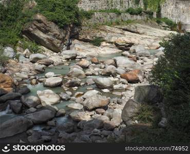 mountain torrent river. mountain torrent river with green water and stones
