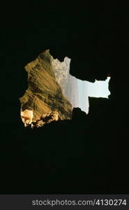 Mountain viewed from a dark cave, Masada, Dead Sea, Israel