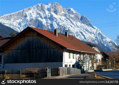 Mountain village in the Alps with traditional buildings