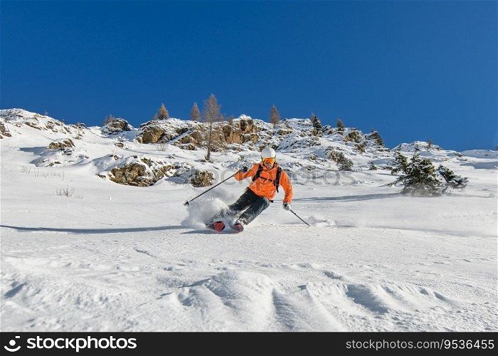 Mountaineering skier downhill on the Italian alps