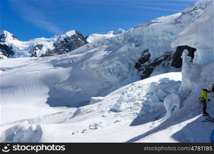 Mountaineering sport. Low angle view of man climbing glacier