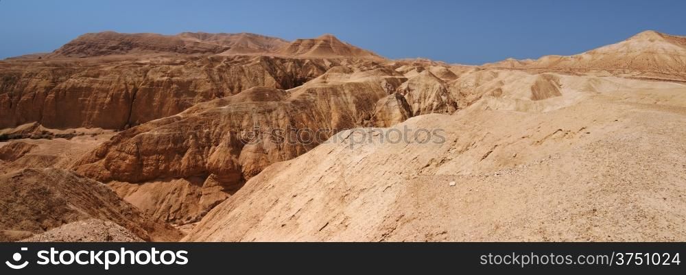 Mountains and canyon in stone desert near the Dead Sea. Mountains and canyon in stone desert