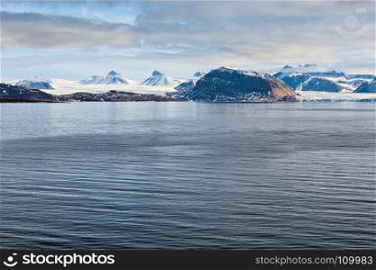Mountains and glacier in Svalbard islands in a sunny day, Norway. Mountains and glacier in Svalbard islands