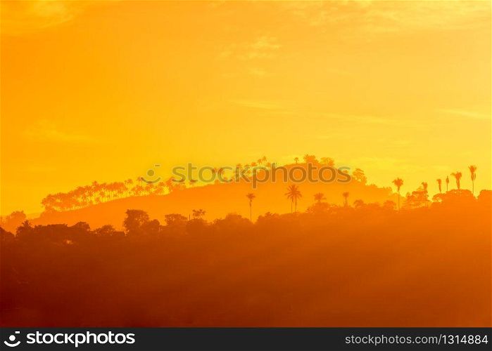 Mountains and trees silhouettes at sunset, Ceylon. Valley landscape of Sri Lanka kingdom. Mountains and trees silhouettes at sunset, Ceylon