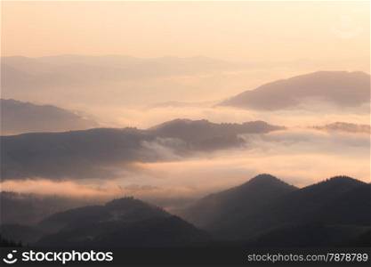 Mountains hills at foggy morning
