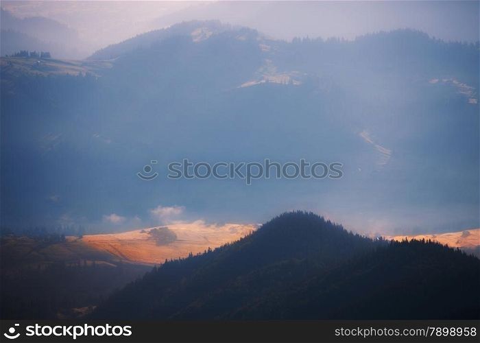 Mountains hills at misty morning