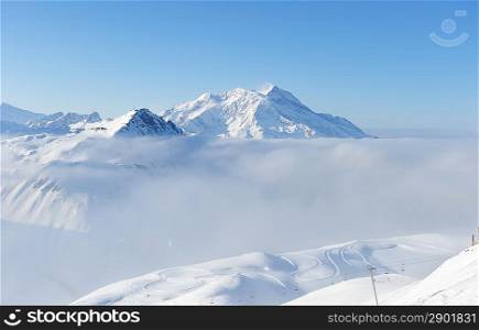 Mountains in clouds with snow in winter, Val-d&acute;Isere, Alps, France