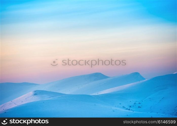 Mountains in snow. Landscape with sunset over hills