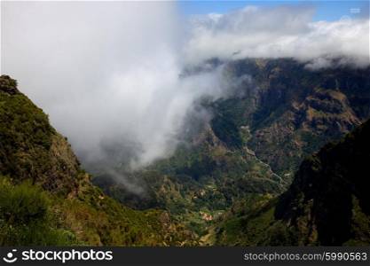 Mountains of Madeira island above the clouds at Encomeada