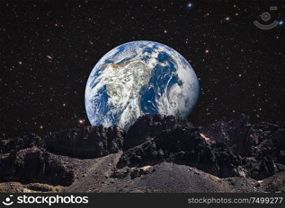 mountains on the moon overlooking planet earth. This image elements furnished by NASA