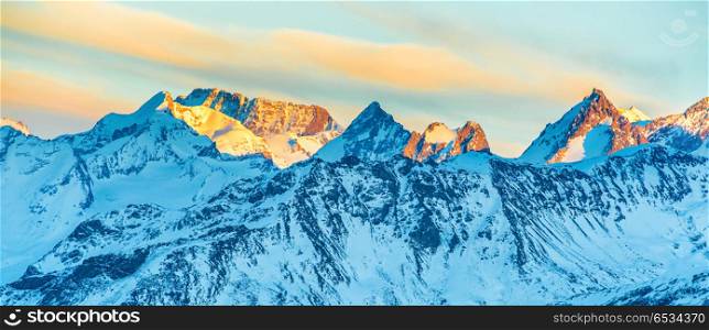 Mountains peaks with snow at sunset. Mountains peaks with snow at sunset, panorama landscape