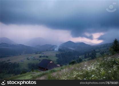 Mountains rural landscape in thunderstorm. Carpathian mountains, Ukraine
