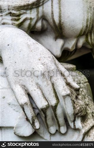 Mourning. detail of a mourning sculpture on a cemetery