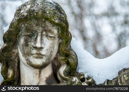 Mourning. detail of a mourning sculpture on a cemetery