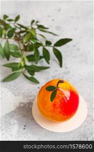 Mousse dessert in the shape of a pear fruit, orange fruit, apricot, lemon and cherry. Mousse cake