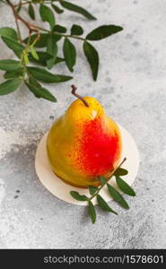 Mousse dessert in the shape of a pear fruit, orange fruit, apricot, lemon and cherry. Mousse cake