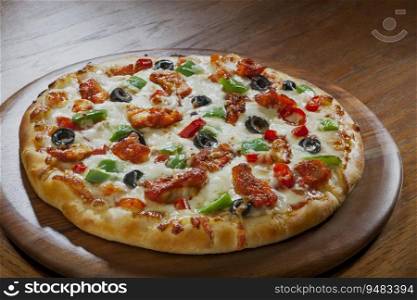 Mouth watering cheesy pizza kept on a wooden plate. 