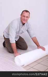 Mover protecting floor with plastic wrap