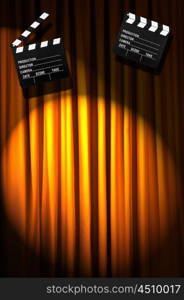 Movie clapper board against curtain