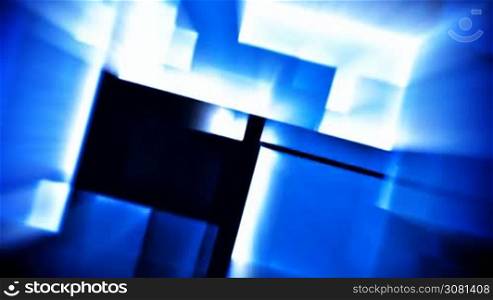 Moving and fading glowing blue squares over black background
