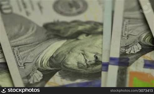 Moving background of hundred dollar bills