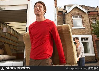 Moving Couple Carrying Sofa