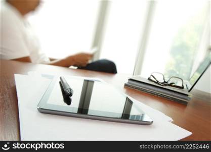 Moving Image of Business creative designer working wooden texture globe with smart phone on business document in office desk as internet concept