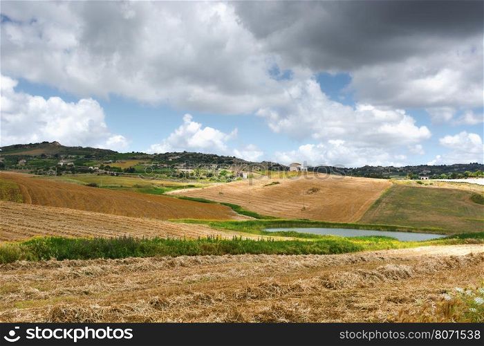 Mown Wheat Field on the Hills in Sicily