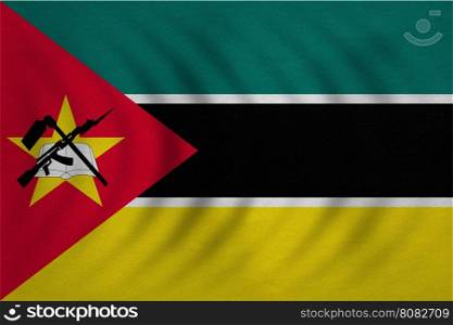 Mozambican national official flag. African patriotic symbol, banner, element, background. Correct colors. Flag of Mozambique wavy with real detailed fabric texture, accurate size, illustration