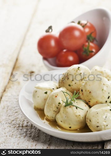 Mozzarella Cheese And Cherry Tomatoes In White Bowls