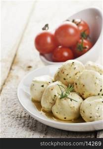 Mozzarella Cheese And Cherry Tomatoes In White Bowls