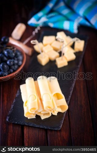 mozzarella cheese and wine in glass on a table