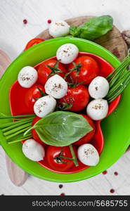 Mozzarella cheese with cherry tomatoes and basil