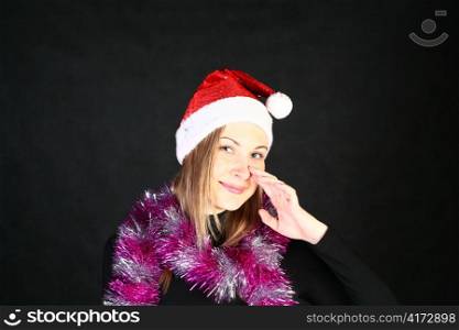 Mrs. Santa dreaming about Christmas on dark background