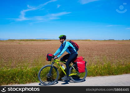 MTB Biker Bicycle touring with pannier racks and saddlebag