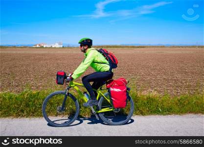 MTB Biker Bicycle touring with pannier racks and saddlebag