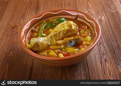 Muamba de galinha - typical dish of Angolan cuisine.in addition to chicken, palm oil, okra, chilli peppers, onions, squash and garlic.