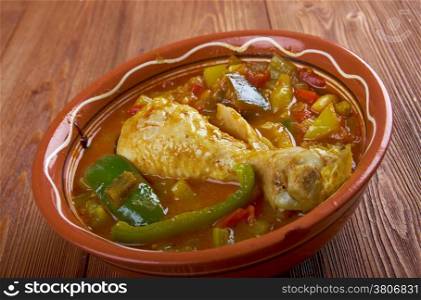 Muamba de galinha - typical dish of Angolan cuisine.in addition to chicken, palm oil, okra, chilli peppers, onions, squash and garlic.