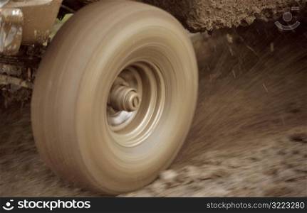 Muddy Truck Tire Peeling Out