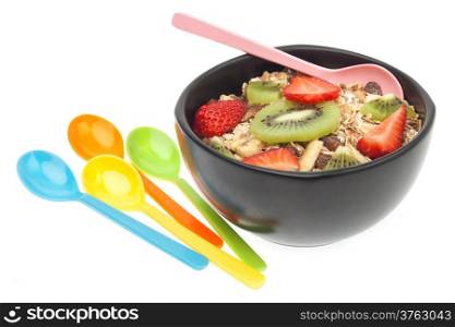 Muesli and fruits in bowl isolated on white background