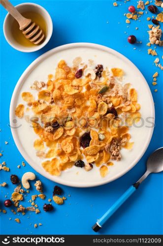 Muesli with yogurt. Healthy breakfast. Healthy lifestyle. Nutrition for children. Breakfast cereal. Top view.