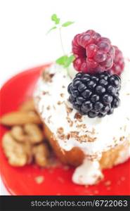 muffin with whipped cream,mint, raspberries, blackberries and nuts