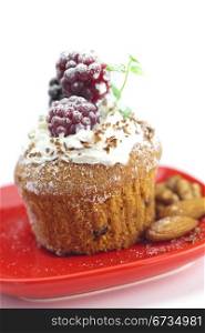 muffin with whipped cream,mint, raspberries, blackberries and nuts