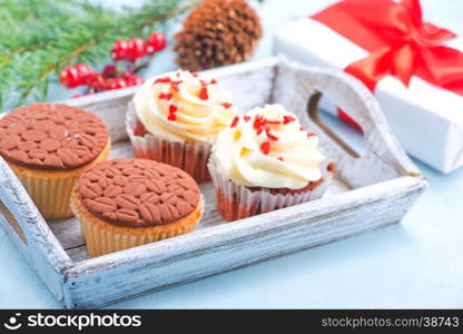 muffins and christmas decoration on a table