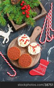 muffins and christmas decoration on a table