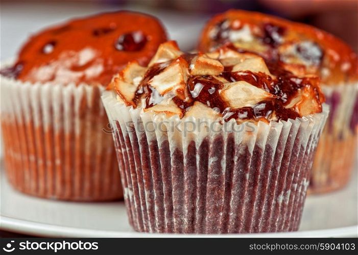 muffins . different muffins with fresh apples on white