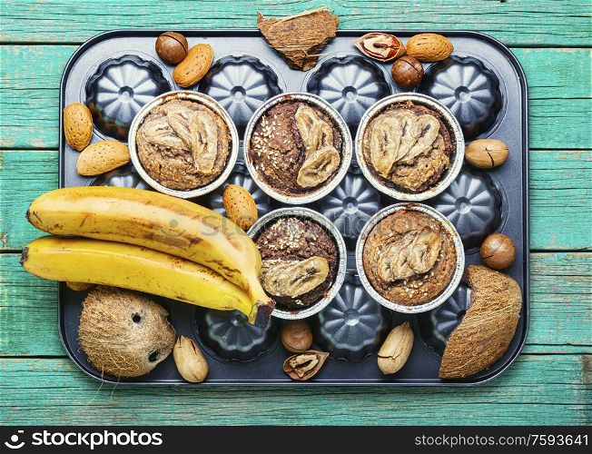 Muffins with banana, nuts and coconut.Healthy vegan banana muffins. Fresh baked banana muffin