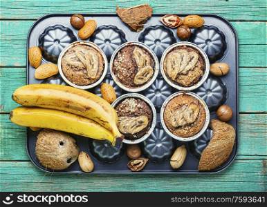 Muffins with banana, nuts and coconut.Healthy vegan banana muffins. Fresh baked banana muffin